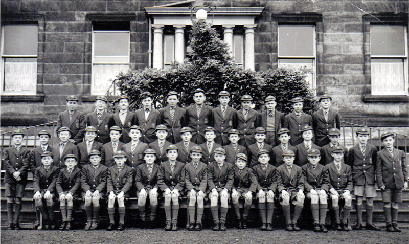 Class Photos Senior 1 1956.jpg - PHOTO PROBABLY IN 1956 OR 1957  -  1ST YEAR (SECONDARY) PUPILS IN PHOTO  (ALL ROWS FROM LEFT TO RIGHT) BACK ROW  Michael BLEAKLEY;  Tony KELLY;  Tony TAYLOR;  Brian VELZEAN;  Keith SINCLAIR;  Max GUNN; Michael SHIELS;  Eddy EPRILE;  Brian HUNT;  Teddy CZERCIECK;  John LYNCH. MIDDLE ROW ???;  Tony WARD;   Robert ROSS;   John MORAN;  Tommy MCILROY;  James WALSHE;  Dennis FLYNN;  Eddy JONES;   Jimmy COLVIN;   Michael LEWIS;   Kenneth GILHOOLY;  Rupert BURRINGTON;  William MORRISON;  Peter WHISTON;  Donald Shaw;  Nigel SMITH. FRONT ROW Roddy ZENTIL;  Brian ECKERSLEY;  ???;  Eugene GALBRAITH;  John BACIGALUPO;   Paul GUNN;  Jo FLAHERTY;  Jimmy MULDOON;  Peter YEO;  Ronnie ROWLEY;  Hugh WRAY;  Michael REYNOLDS;  Neil MACKENZIE. Names supplied by Tony Ward, (if you see any errors please let us know)